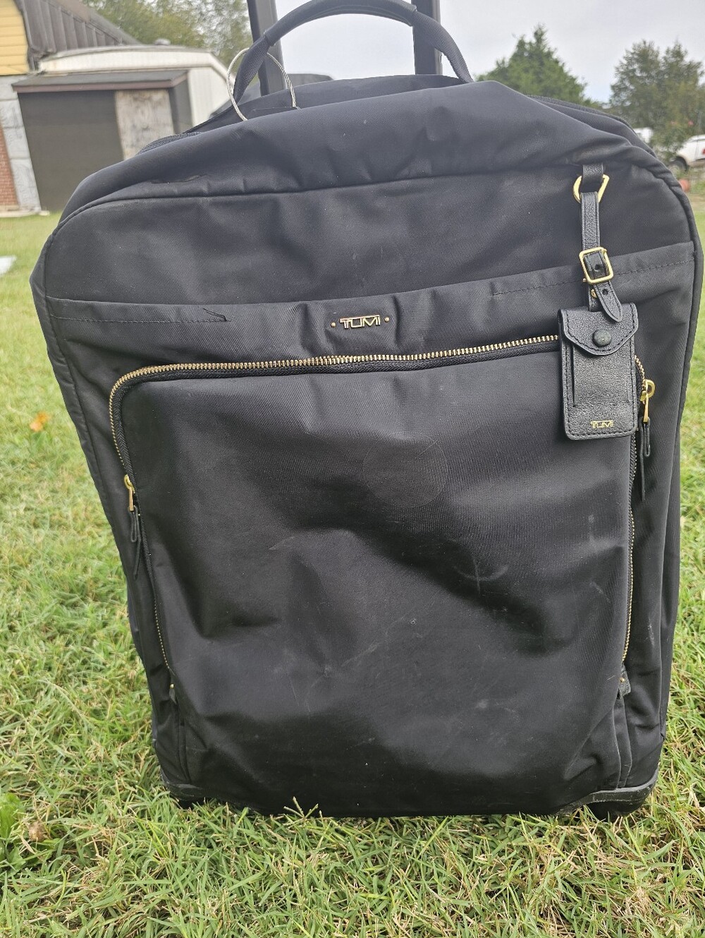 Tumi Black Travel Rolling Duffel with Gold Hardware